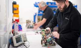 Man repairing Yamato weigh actuator